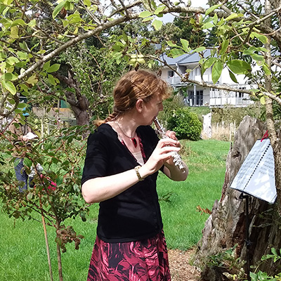 Flautist in the orchard
